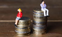 Plastic workers sitting on stacks of coins to represent income inequality