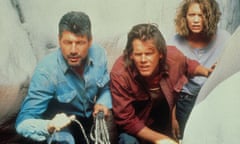 Fred Ward, left, Kevin Bacon and Finn Carter in Tremors, 1990. ‘When it came to battling underground worms, I couldn’t have asked for a better partner,’ Bacon said.