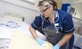 Nurse carrying out a bed changeover