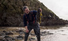 Jayson Byles forages on a beach in Scotland.