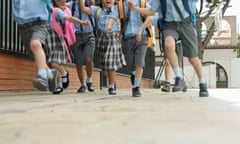 School children running.