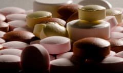 Generic pills of different colours in a pile