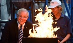 The prime minister, Scott Morrison, watches a burn roller at a visit to AusProof manufacturing facility in Gladstone