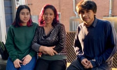 Eva Garcia, center, with her children Kimberly and Cristofer. The students, who attend Orthopaedic Hospital Medical Magnet high school in Los Angeles, have struggled to stay connected to the internet for distance learning since schools closed a year ago.