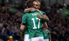 Northern Ireland's Josh Magennis and Paddy McNair celebrate after Benas Satkus’s own goal