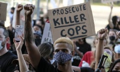 A demonstrator raises his fist during a protest of the death of George Floyd, a black man who was in police custody in Minneapolis, in downtown Los Angeles, Wednesday, May 27, 2020. (AP Photo/Ringo H.W. Chiu)