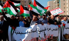 TOPSHOT-ISRAEL-US-PALESTINIAN-CONFLICT<br>TOPSHOT - Arab demonstrators protest in front the new United States embassy in Jerusalem on May 14, 2018. The banner reads in Arabic " Jerusalem is Arab, Palestinian, Moslem, Christian". The United States moved its embassy in Israel to Jerusalem after months of global outcry, Palestinian anger and exuberant praise from Israelis over President Donald Trump's decision tossing aside decades of precedent. / AFP PHOTO / AHMAD GHARABLIAHMAD GHARABLI/AFP/Getty Images
