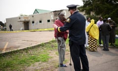 Mussa Jarso, a member of the Tahwid Islamic Center community, speaks with St. Paul Police Deputy Chief Josh Lego near the burned-out center Wednesday, May 17, 2023, in St. Paul, Minn. Jarso expressed his frustration over the United States' response to terror attacks committed against his community. According to court records, a man charged with setting the fire at the Minnesota mosque told authorities he is Muslim and set the fire to protest homelessness. (Aaron Lavinsky/Star Tribune via AP)