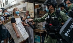 Police confront pro-democracy campaigners in Hong Kong on 6 September.