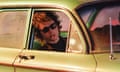 Timothée Chalamet as Bob Dylan in a car in A Complete Unknown