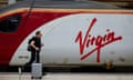 Man running to catch virgin train