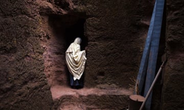 A pilgrim at a 13th century church carved out of rock at Lalibela in Ethiopia.