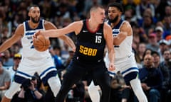 Nikola Jokic sees off the attentions of Rudy Gobert and Karl-Anthony Towns