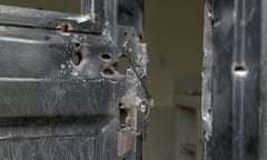 Bullet holes in a metal door that was shot open at the Terrain hotel compound in Juba, South Sudan.