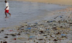 Senegal's beaches polluted<br>epa00158500 A Senegalese man wades in the Atlantic Ocean off a polluted beach in N'gor Senegal Monday 22 March 2004. Today is international World Water Day 2004 and focuses on the theme: Water and Disasters. According to Senegalese law it is illegal to dispose of waste and waste water in public places. However due to problems with local municipalities, who are responsible for waste disposal, inadequate facilities are available for the safe removal of waste.Thus many communities dispose of their waste themselves on any available open public ground or stream or beach. This has severe health implications as well as devastating marine environments. It is estimated by the World Health Organisation that most deaths and pathological complaints in developing countries are associated with a water-related carrier.  EPA/NIC BOTHMA