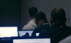 uk security staff sitting in front of computers