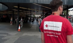 British Red Cross chugger asking for donations in front of King's Cross Train Station