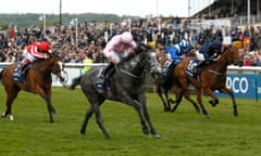 Winter, ridden by Wayne Lordan, wins the Qipco 1,000 Guineas from Rhododendron, finishing late on the far side, and Daban