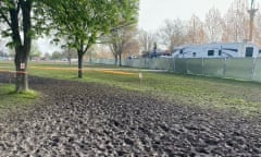 mud and churned up grass in finsbury park after the tough mudder event