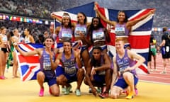 Great Britain’s men’s and women’s 4x400m relay teams pose after claiming bronze medals