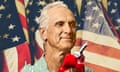 A stylized image of an old white man with a smirk on his face and holding a gas pump in his hand. In the background a part of the Stars and Stripes is visible.