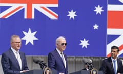 Anthony Albanese, Joe Biden and Rishi Sunak in front of giant Australian, British and American flags