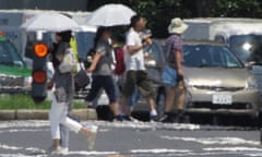 TOPSHOT-JAPAN-WEATHER<br>TOPSHOT - The effects of heat haze is seen in this photograph as pedestrians cross a street during a heatwave in Tokyo on August 2, 2018.       / AFP PHOTO / Kazuhiro NOGIKAZUHIRO NOGI/AFP/Getty Images