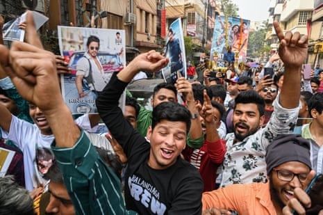 people cheer in street