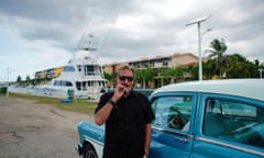 FILE PHOTO: John McAfee smokes a cigarette before taking a taxi at the Marina Hemingway in Havana<br>FILE PHOTO: John McAfee, co-founder of McAfee Crypto Team and CEO of Luxcore and founder of McAfee Antivirus, smokes a cigarette before taking a taxi at the Marina Hemingway in Havana, Cuba, July 4, 2019. Picture taken July 4, 2019. REUTERS/Alexandre Meneghini/File Photo