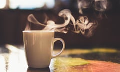 Close up of steaming cup of tea on vintage table