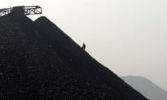 A labourer searches for usable coal at a cinder dump site on the outskirts of Changzhi, Shanxi province October 27, 2009. Spot thermal coal prices in China's top coal shipping port Qinhuangdao continued to rise this week to their highest levels in about 11 months, and the strength is likely to remain as demand grows, traders and analysts said on Tuesday.    REUTERS/Stringer   (CHINA ENERGY BUSINESS IMAGES OF THE DAY) CHINA OUT. NO COMMERCIAL OR EDITORIAL SALES IN CHINA