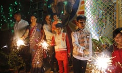 People play with fireworks in Prayagraj, India