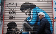 A mural depicting Diego Maradona and a little girl made by the artist Franco Martinez, in the Spanish quarters of Naples, Italy.