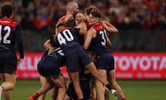 The Demons celebrate after defeating the Bulldogs during the 2021 AFL Grand Final match.