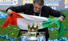 Roberto Mancini celebrates after leading Manchester City to the Premier League title in 2012.