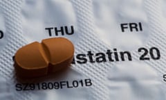 A statin tablet against a blister pack