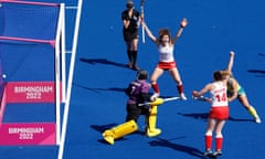 Tess Howard of England (right) celebrates scoring England's second goal with teammate Holly Hunt during the women's hockey final between England and Australia at the Commonwealth Games