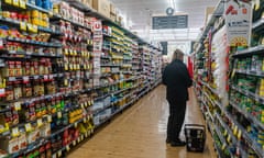 A person in a supermarket aisle