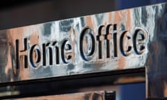 A silver Home Office sign