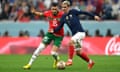 Antoine Griezmann battles for possession with Morocco’s Selim Amallah.