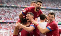 Serbia players go wild after Luka Jovic’s last-gasp equaliser.