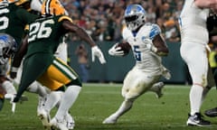 Detroit Lions running back David Montgomery (5) tries to elude Green Bay Packers safety Darnell Savage (26) during the second half of Thursday’s game.