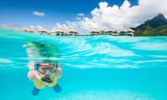 Woman snorkeling in a tropical lagoon