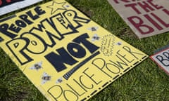 Placards lie on the ground during a protest in London against the 2021 police and crime bill.