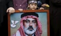 A Palestinian boy wearing the headband of Hamas' armed wing stands behind a picture of senior Hamas leader Ismail Haniyeh.