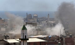 Smoke billows during clashes between Fatah movement and Islamists inside the Ain al-Hilweh Palestinian refugee camp