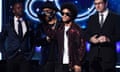 Bruno Mars receives the Grammy for record of the year on Sunday night in New York.