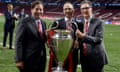 FSG’s Tom Werner, Mike Gordon and John Henry with the Champions League trophy in 2019.