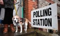 A voter leaves with their dog, Lilly, after casting their vote at a polling station in Brighton, 12 December 2019