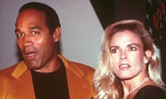 Woman with blond hair and man in tan jacket and black T-shirt